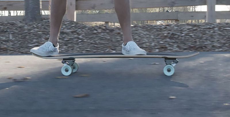 riding a cheap longboard